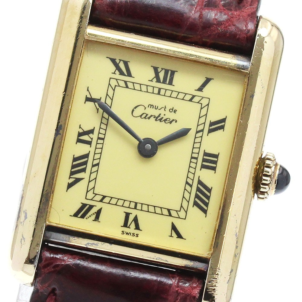 Cartier Must Tank women's manual wind wristwatch leather strap: Cartier Must Tank women's manual wind wristwatch leather strap Cartier Must Tank ladies' wristwatch with a hand-wound movement and classic rectangular design. This Swiss-made watch features a beige di
