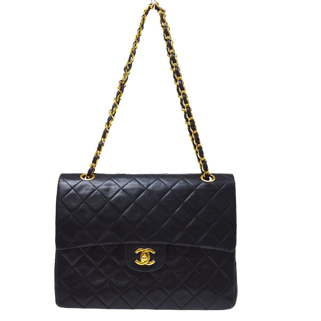 Chanel Vintage Classic Double Flap Black Leather Handbag: Chanel Vintage Classic Double Flap Black Leather Handbag A Chanel Vintage Classic Double Flap bag in black leather with the timeless quilted design. Made in France, this women's handbag is presented i