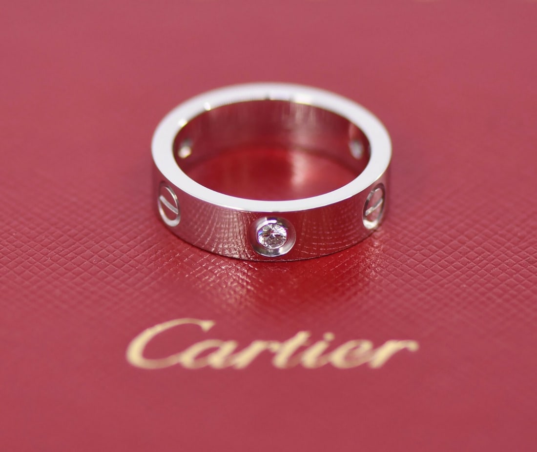 Cartier 3 Diamond 18k White Gold Love Ring Authentic with Box: Cartier 3 Diamond 18k White Gold Love Ring Authentic with Box This exquisite 3 Diamond Love Ring by Cartier is crafted from luxurious 18k white gold, embodying the essence of elegance and love. The ri