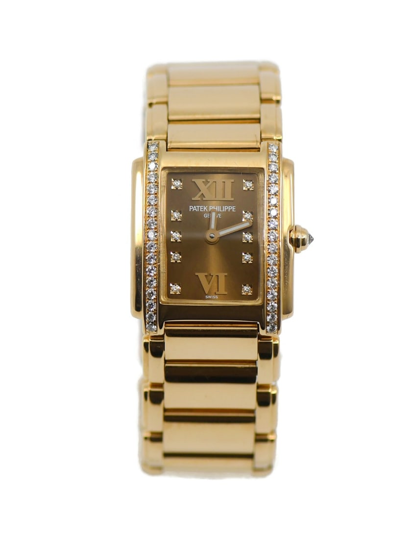 Patek Philippe Twenty-4 4908 11R Rose Gold Diamond Wristwatch: Patek Philippe Twenty-4 4908 11R Rose Gold Diamond Wristwatch Patek Philippe Twenty-4 wristwatch in 18K rose gold with a diamond-pattern brown dial and diamond bezel. This women's luxury watch feature