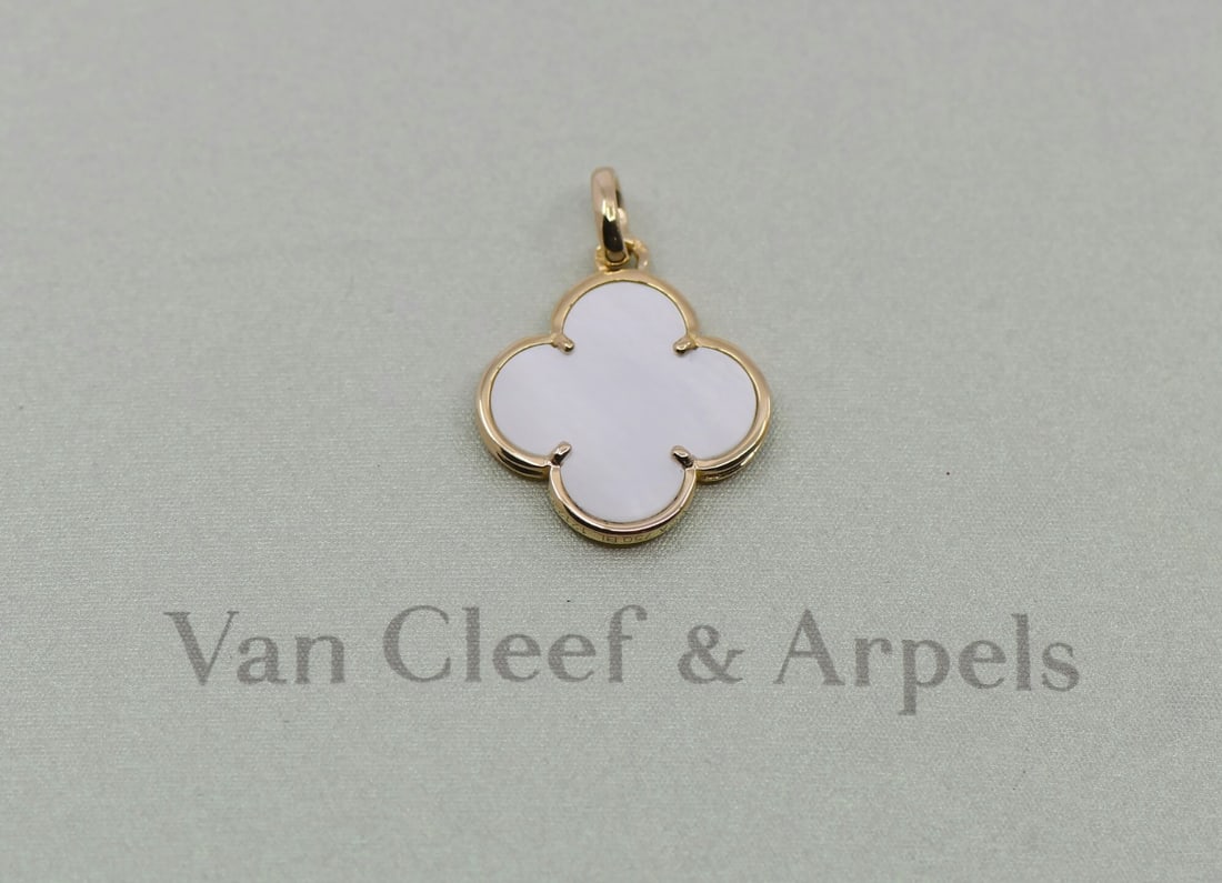 Van Cleef & Arpels Pure Alhambra 18K Gold Pendant 22mm: Van Cleef & Arpels Pure Alhambra 18K Gold Pendant 22mm Van Cleef & Arpels Pure Alhambra pendant crafted in 18k yellow gold with a mother of pearl/abalone design. This pre-owned pendant includes a pouc