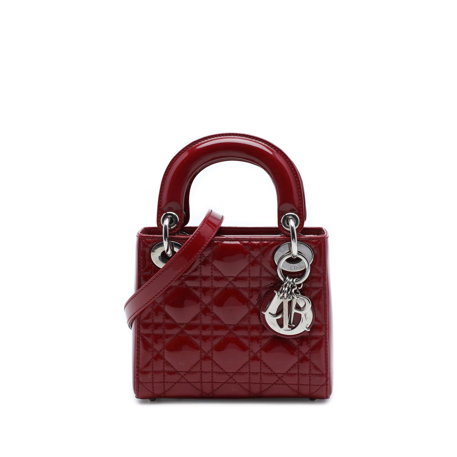 Dior Lady Dior Mini Cannage Patent Leather Bag Red: Dior Lady Dior Mini Cannage Patent Leather Bag Red A compact Lady Dior handbag crafted in red patent leather with the signature Cannage quilted design. This mini bag features flat top handles, a detac