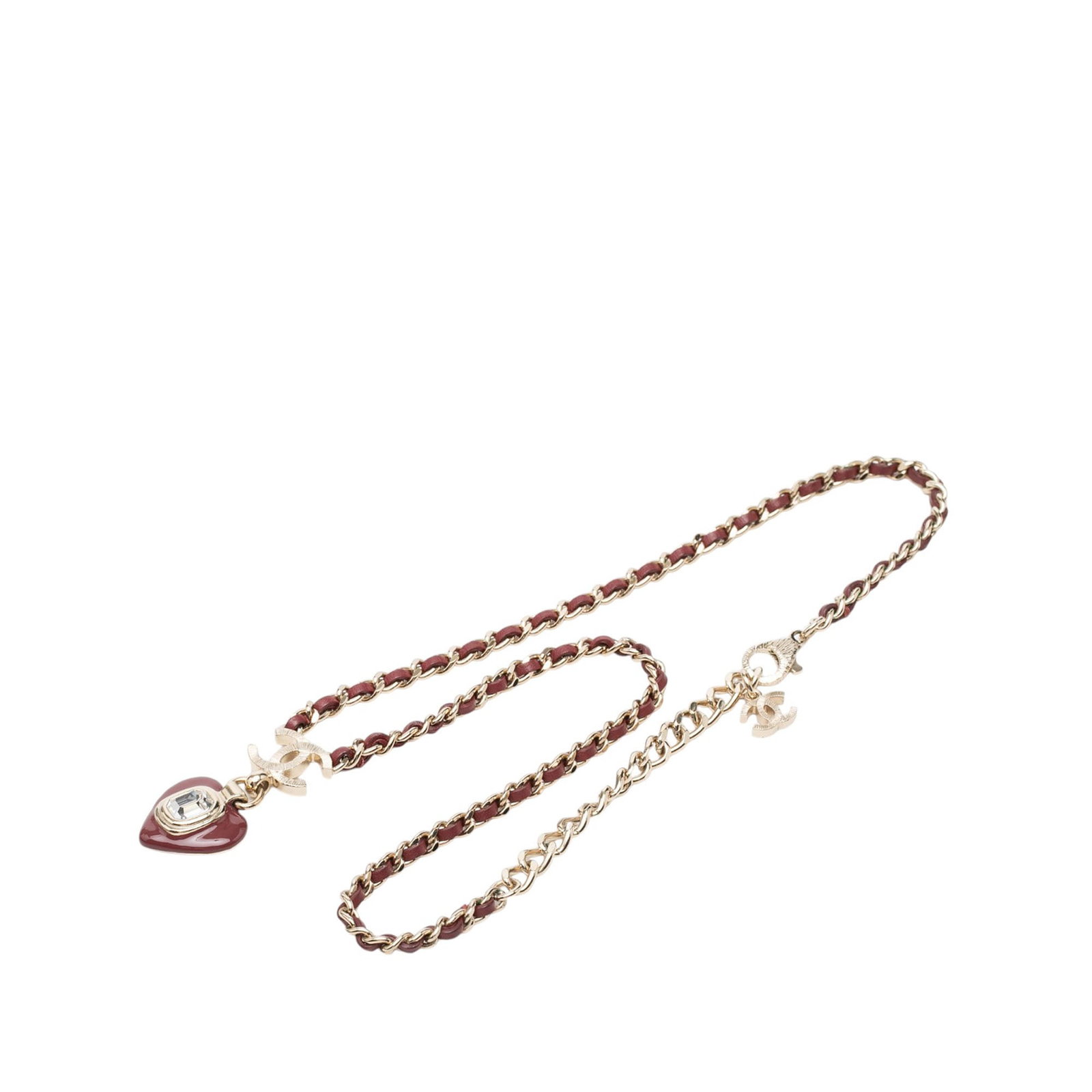 Chanel CC Heart Pendant Necklace Gold Plated Leather Resin Crystal: Chanel CC Heart Pendant Necklace Gold Plated Leather Resin Crystal Chanel heart pendant necklace featuring a gold plated chain woven with leather and a resin pendant accented with crystal detail. Fini