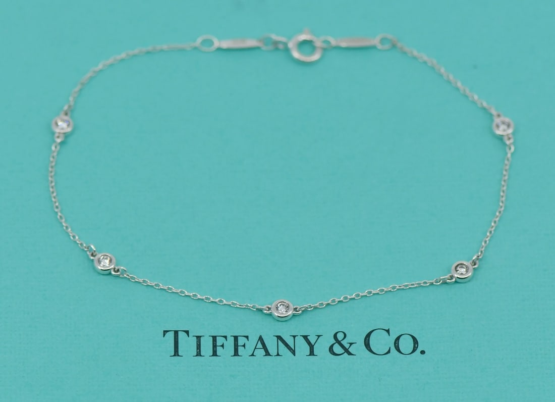 Tiffany Co Elsa Peretti Diamond By Yard 0.15CT Sterling Bracelet: Tiffany Co Elsa Peretti Diamond By Yard 0.15CT Sterling Bracelet Tiffany & Co. Elsa Peretti Diamond by the Yard bracelet crafted in sterling silver with a diamond accent. This chain-style bracelet is 