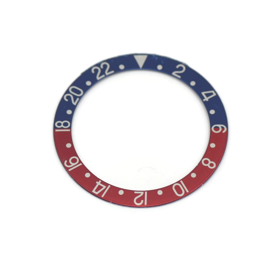 Rolex 1675 GMT-Master Pepsi bezel insert: Rolex 1675 GMT-Master Pepsi bezel insert Pre-owned Rolex GMT-Master insert 1675. This authentic insert is made for a Rolex GMT-Master and is identified as a Pepsi insert. Specifications Brand: Rolex I
