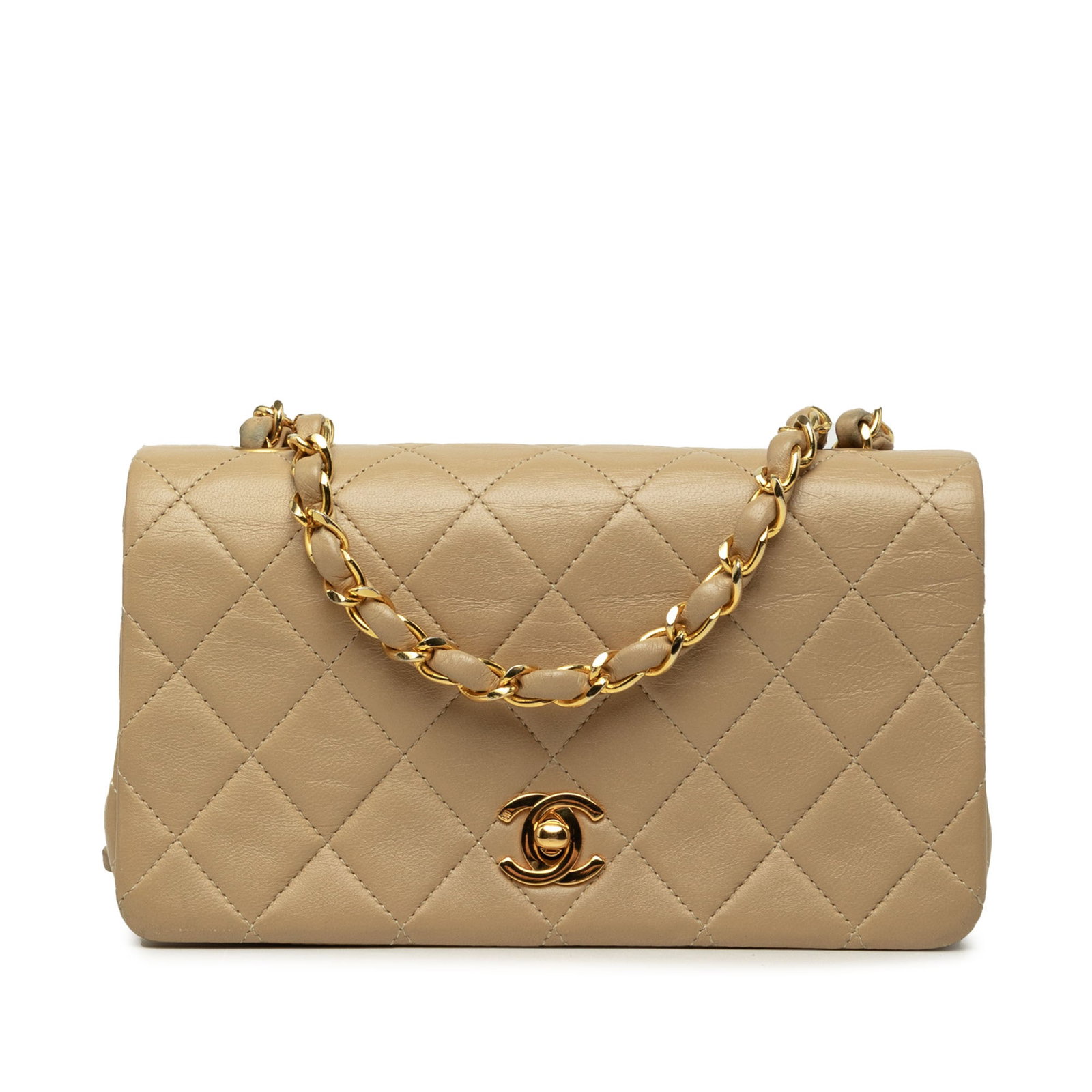 Chanel Mini Rectangular Flap Crossbody Bag Beige Quilted Lambskin: Chanel Mini Rectangular Flap Crossbody Bag Beige Quilted Lambskin A Chanel Mini Rectangular CC Quilted Lambskin Full Single Flap crossbody bag crafted in beige quilted lambskin leather. It features a 