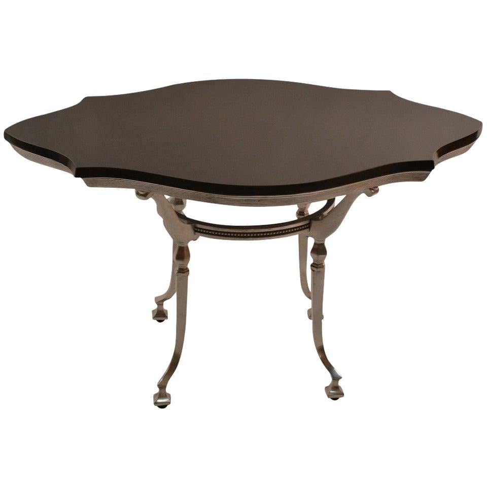 Elegant Black Cast Aluminum Table with Polished Stone Top: Elegant Black Cast Aluminum Table with Polished Stone Top This elegant Classical Style Cast Aluminum Table features a sturdy cast aluminum base paired with a polished stone top, making it a perfect ch