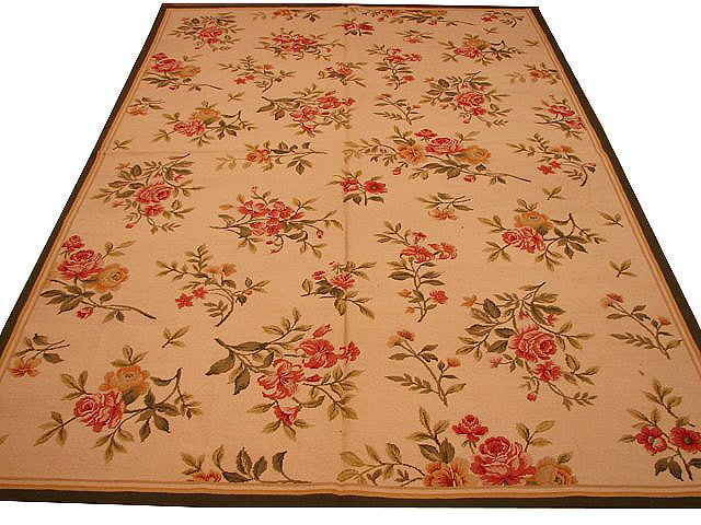 6' x 9' Ivory Hand-Knotted Needlepoint Area Rug: 6' x 9' Ivory Hand-Knotted Needlepoint Area Rug Free continental US Shipping Enhance your living space with the timeless elegance of the 6' x 9' Ivory Needlepoint Rug. This beautifully handcrafted are