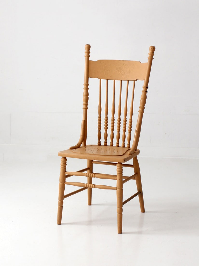 Antique Spindle Pressback Chair with Painted Floral Crest 42.5 inch: Antique Spindle Pressback Chair with Painted Floral Crest 42.5 inch Antique pressback spindle chair with a tall turned frame, a floral crest rail, and slender proportions. The old mustard ochre paint 