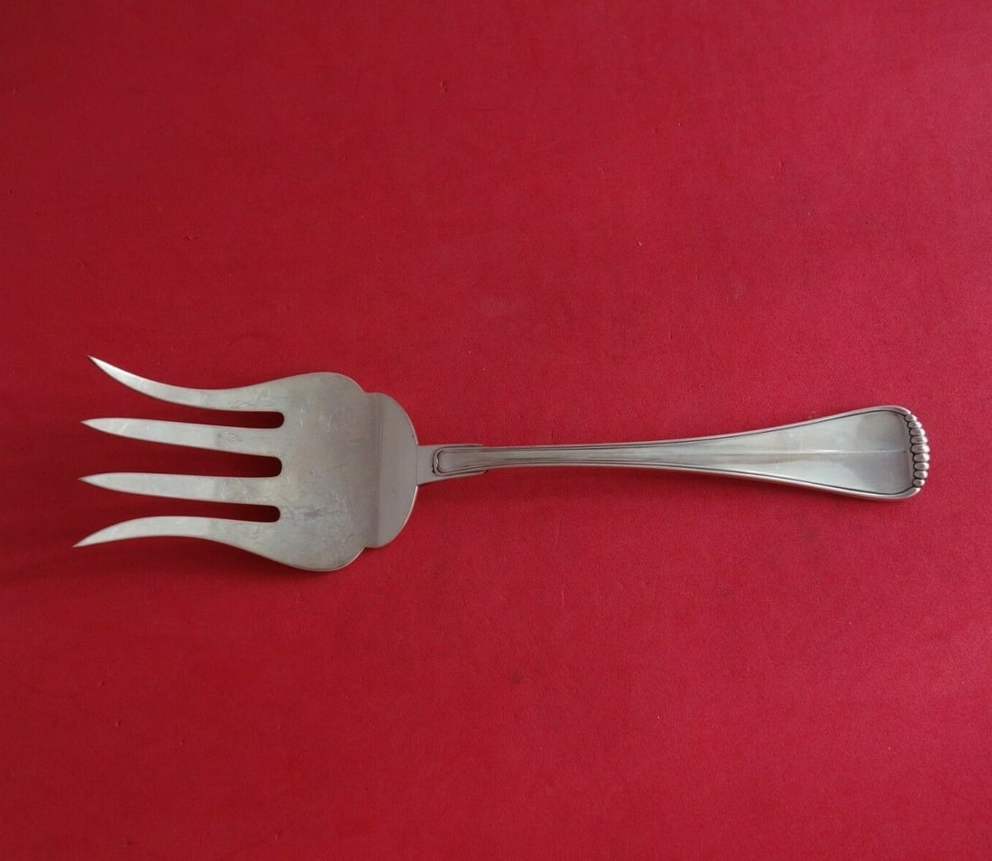 Buccellati Milano Sterling Silver Fish Serving Fork 8 7/8: Buccellati Milano Sterling Silver Fish Serving Fork 8 7/8 Milano by Buccellati fish serving fork crafted in sterling silver. This Italian-made serving piece features the Milano pattern, a four-tine de