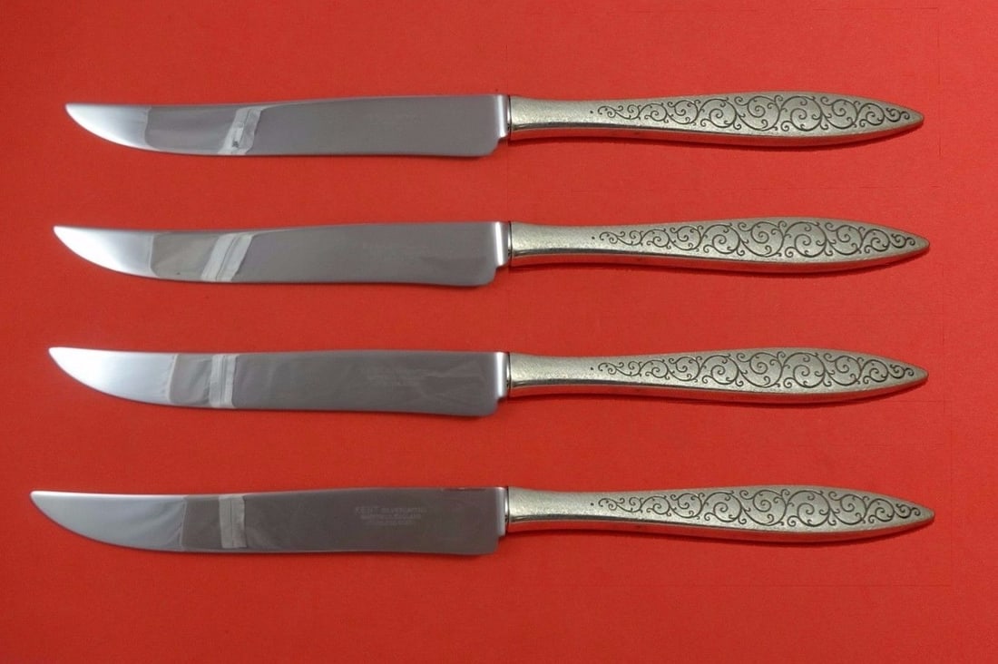 4 Piece Wallace Spanish Lace Sterling Steak Knives Texas Sized: 4 Piece Wallace Spanish Lace Sterling Steak Knives Texas Sized Four-piece custom steak knife set in the Spanish Lace pattern by Wallace. Each knife features a sterling silver hollow handle with a stai