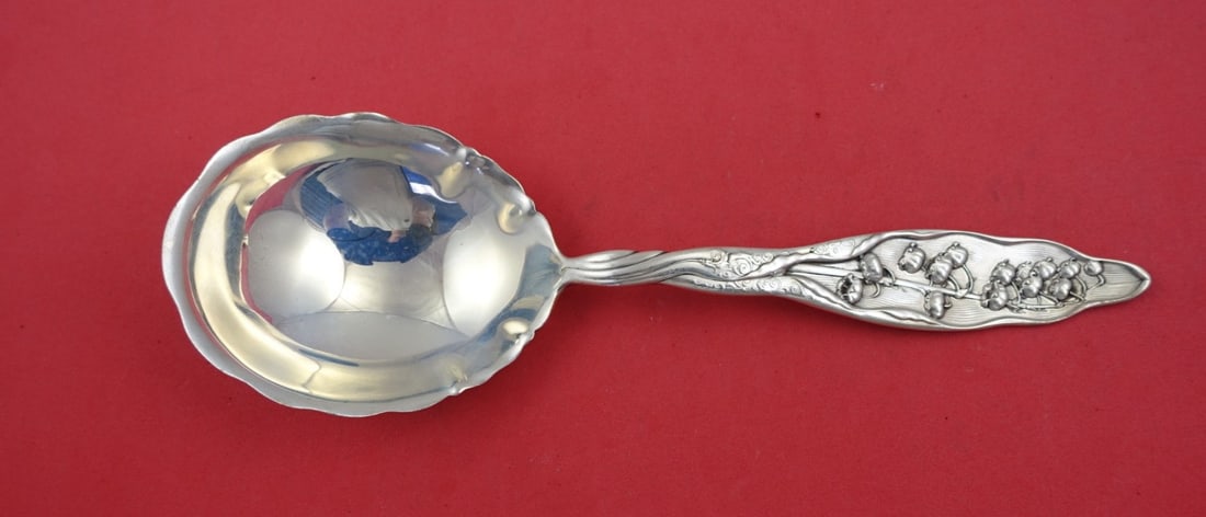 Whiting Sterling Silver Lily of the Valley Berry Spoon 8.5": Whiting Sterling Silver Lily of the Valley Berry Spoon 8.5" This exquisite serving spoon, crafted by Whiting, showcases the beautiful "Lily of the Valley" pattern, patented in 1885. Made from sterling