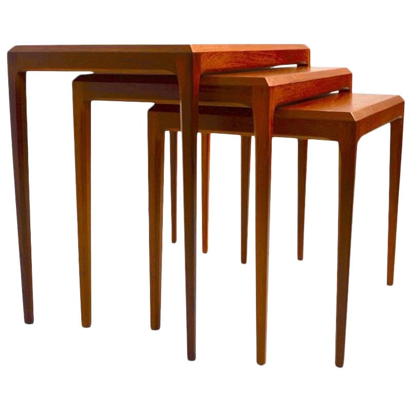 Danish Modern Nest of 3 Teak Tables by Johannes Andersen: Danish Modern Nest of 3 Teak Tables by Johannes Andersen Featuring a sleek design, this Danish modern nest of three tables is crafted from high-quality teak wood by Johannes Andersen for CFC Mobler Si