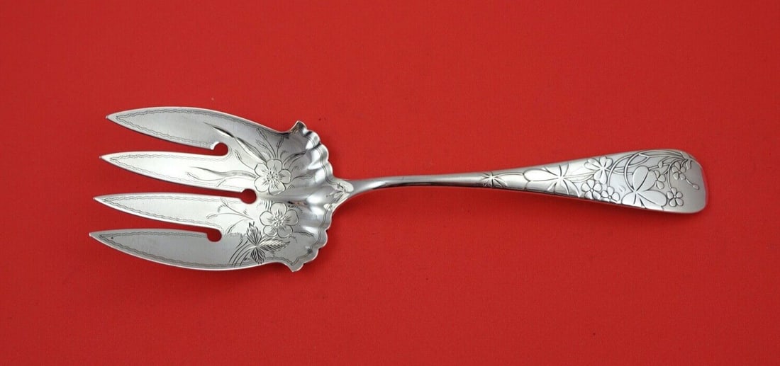 Sterling Fish Serving Fork Frank Whiting Oxalis 8 1/8 brite cut tines: Sterling Fish Serving Fork Frank Whiting Oxalis 8 1/8 brite cut tines Sterling silver fish serving fork in the Oxalis pattern by Frank Whiting. It features brite-cut tines, a multi-motif design, and i
