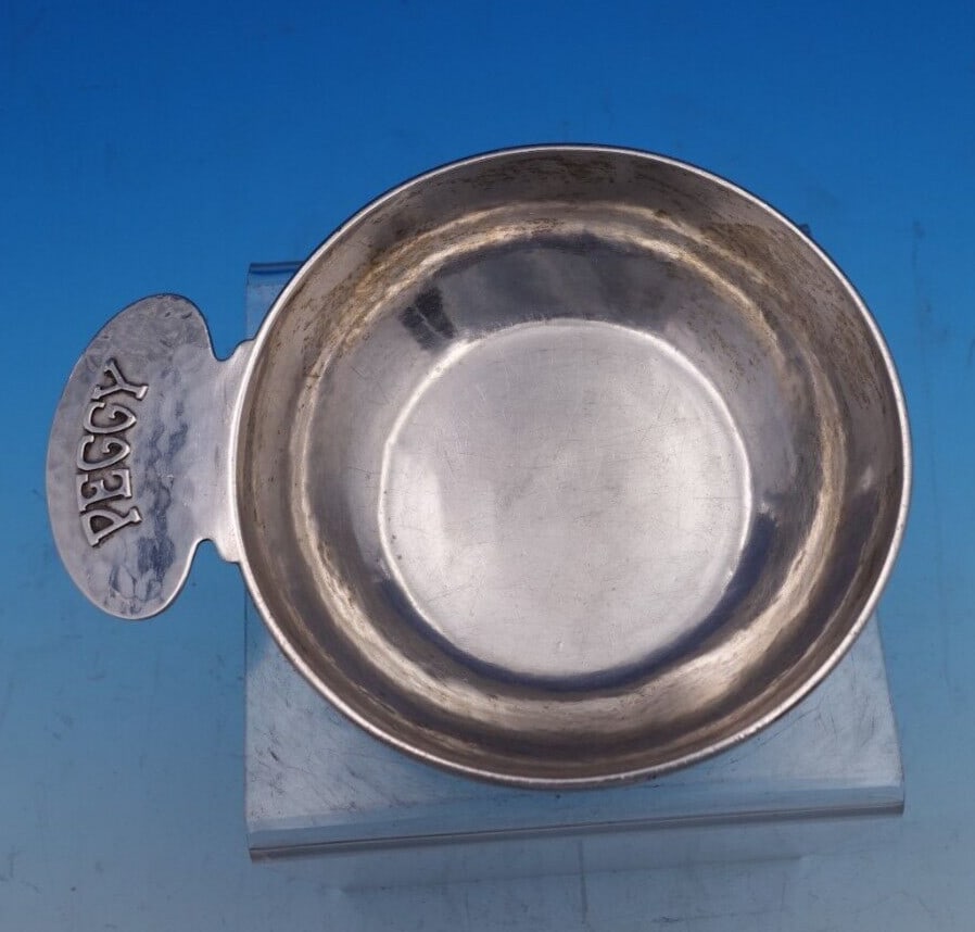 Kalo handwrought sterling silver porringer with Peggy monogram 1 3/4" x 6": Kalo handwrought sterling silver porringer with Peggy monogram 1 3/4" x 6" Handwrought Kalo sterling silver porringer with an applied monogram reading "Peggy" on the handle and an underside engraving 