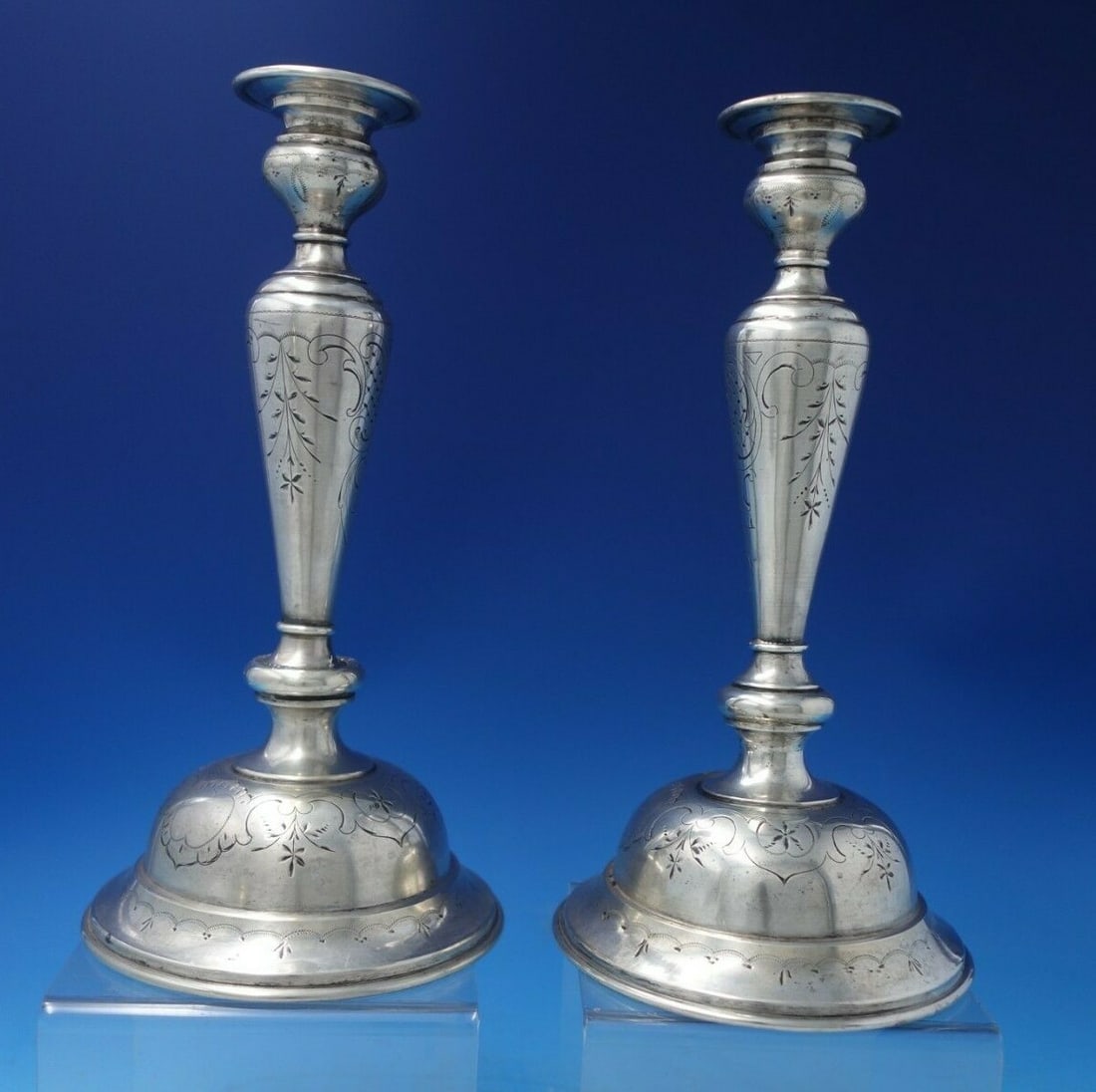 Austrian .800 Silver Candlestick Pair Rococo Hand Engraved Flowers: Austrian .800 Silver Candlestick Pair Rococo Hand Engraved Flowers This exquisite pair of Austrian .800 silver candlesticks showcases a stunning rococo design, enhanced by intricate hand-engraved flor