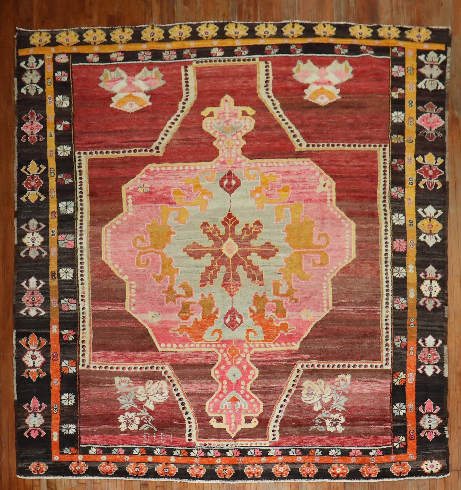 10' 8" x 11' 6" Square Turkish Kars Floral Area Rug: 10' 8" x 11' 6" Square Turkish Kars Floral Area Rug 20th century Turkish Kars square-size rug with a large-scale floral design. The pattern features a bright pink medallion set against a striated brow