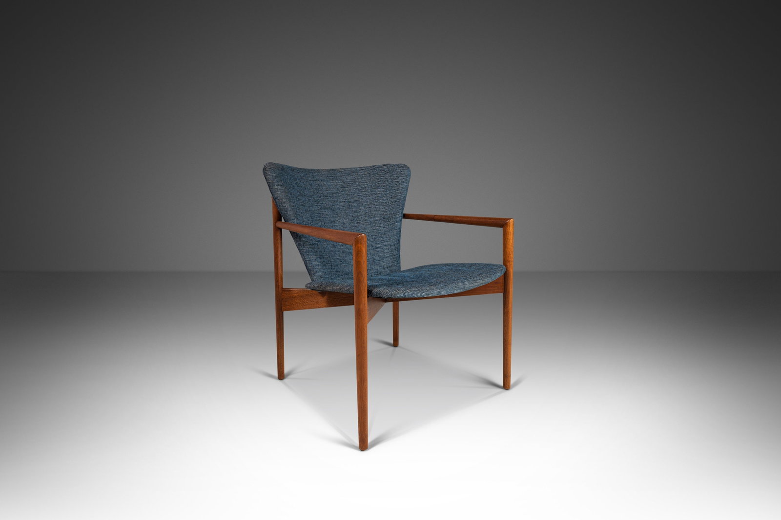 Rare 1950s Angular Lounge Chair in Walnut Inspired by Nanna Ditzel: Rare 1950s Angular Lounge Chair in Walnut Inspired by Nanna Ditzel Introducing a rare angular lounge chair, inspired by the designs of Nanna Ditzel and dating back to the 1950s. This distinctive armch