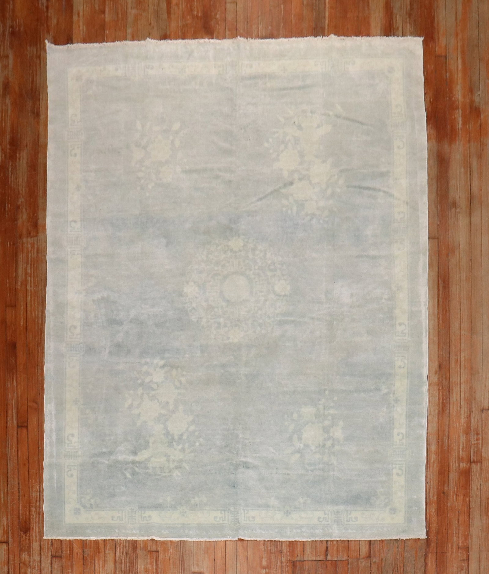 6' 7" x 8' 10" Early 20th Century Peking Chinese Rug: 6' 7" x 8' 10" Early 20th Century Peking Chinese Rug Early 20th century Chinese Peking rug in a light blue and ivory color palette. This pre-owned rug offers a classic design and traditional craftsman