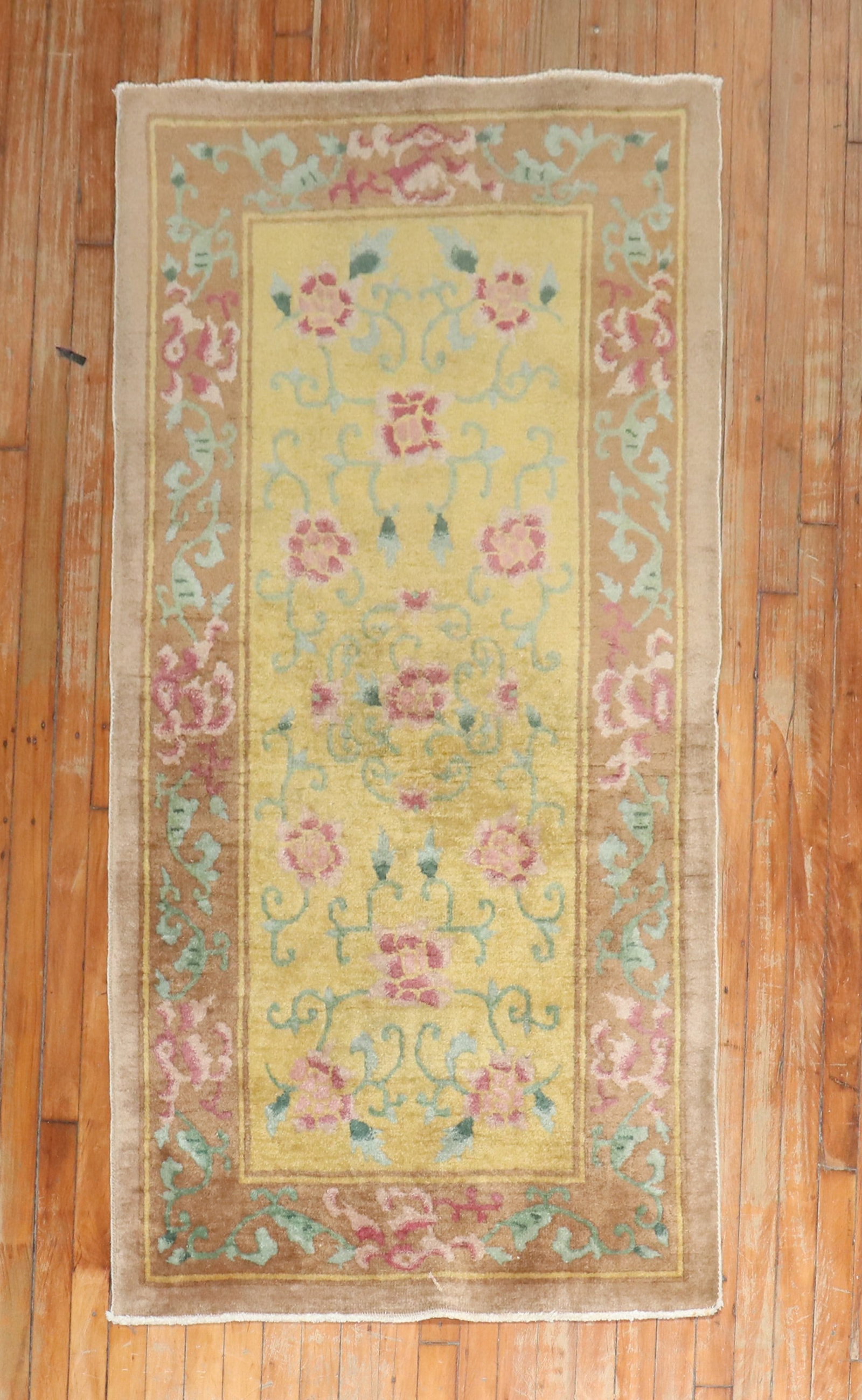 2' 11" x 5' 9" Chinese Deco Floral Rug Yellow Field: 2' 11" x 5' 9" Chinese Deco Floral Rug Yellow Field 1940s Chinese Art Deco rug featuring a floral motif on a yellow field. This pre-owned small rug has a classic rectangular form and soft floral decor