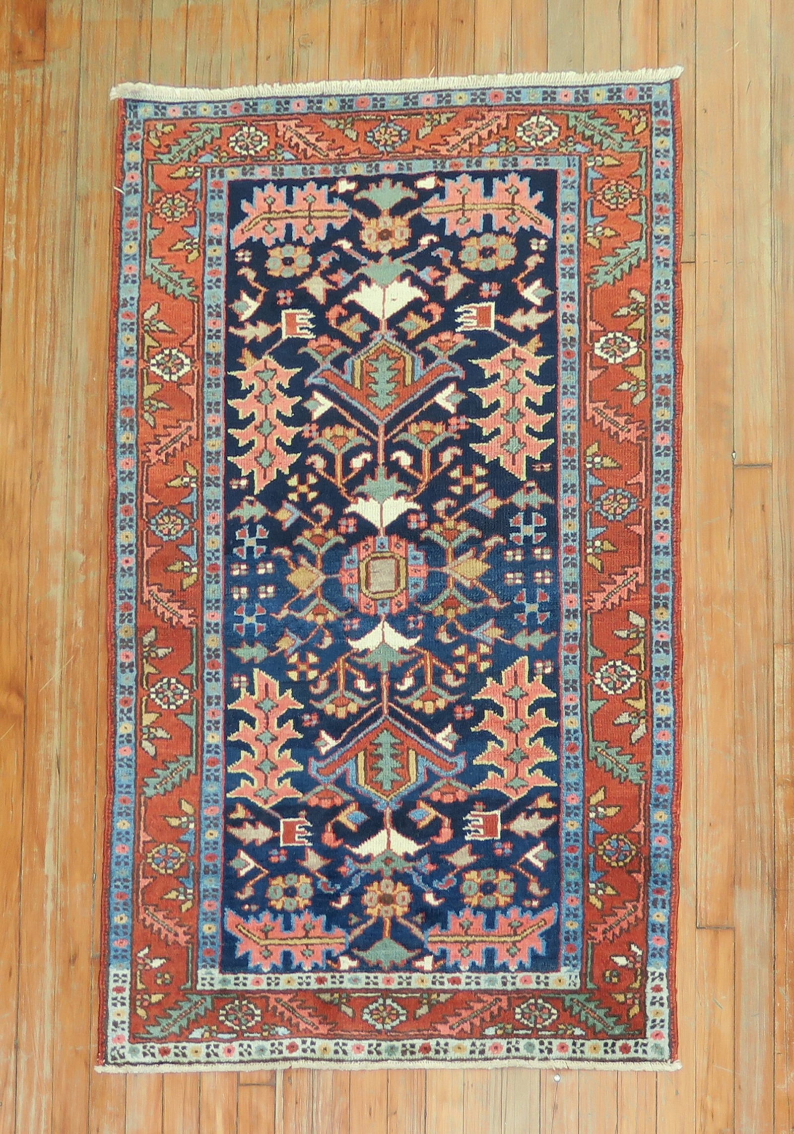 2' 11" x 4' 6" Persian Serapi Heriz Rug circa 1920: 2' 11" x 4' 6" Persian Serapi Heriz Rug circa 1920 Antique Persian Heriz rug with a navy field and intricate floral and geometric patterning. This circa 1920 piece is classified as a small Serapi/Heri
