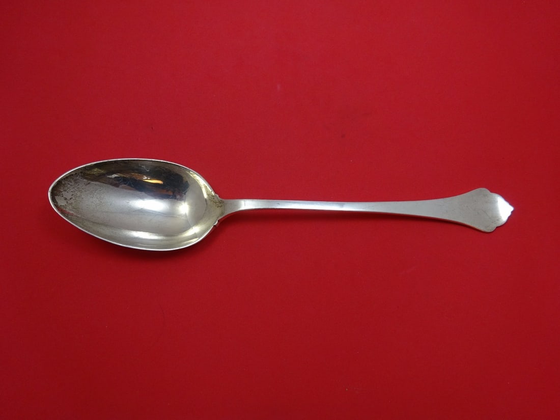 Reed & Barton Sterling Silver Serving Spoon No Button 11.625": Reed & Barton Sterling Silver Serving Spoon No Button 11.625" This exquisite serving spoon by Reed & Barton features a classic design without a button, measuring 11 5/8 inches in length. Crafted from 