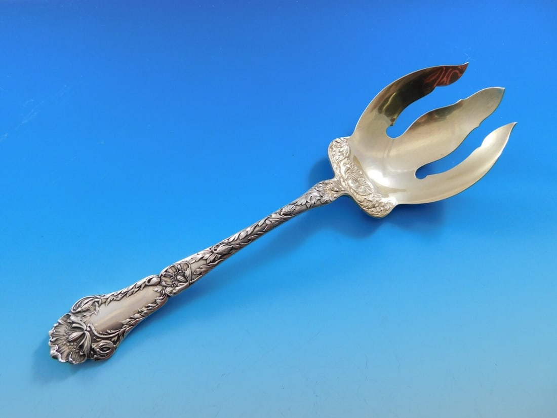 Gorham Poppy sterling silver salad serving fork gold washed 8 1/2 Heirloom: Gorham Poppy sterling silver salad serving fork gold washed 8 1/2 Heirloom Sterling silver salad serving fork in the Poppy pattern by Gorham, featuring a gold washed finish and decorative multi-motif 