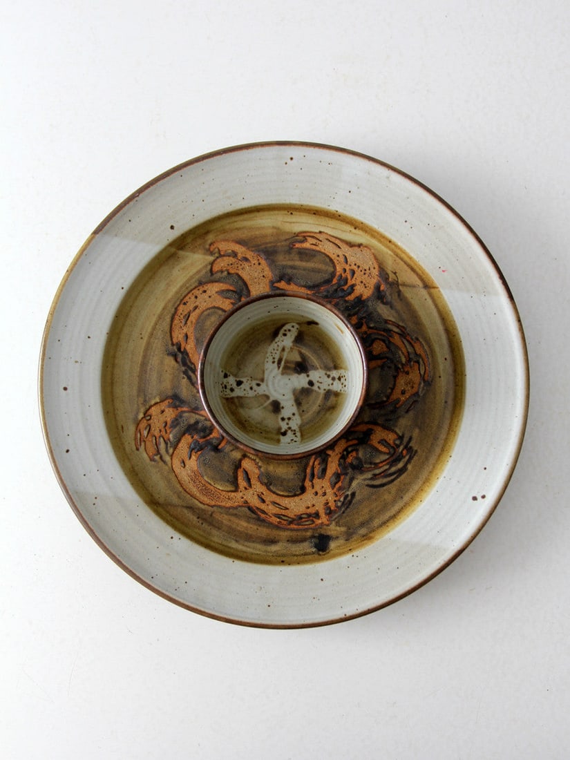 Signed Stoneware Chip and Dip Platter by Don Hanson: Signed Stoneware Chip and Dip Platter by Don Hanson This signed Don Hanson studio pottery chip and dip platter features an integrated center bowl, wheel-thrown in stoneware. The piece is finished with