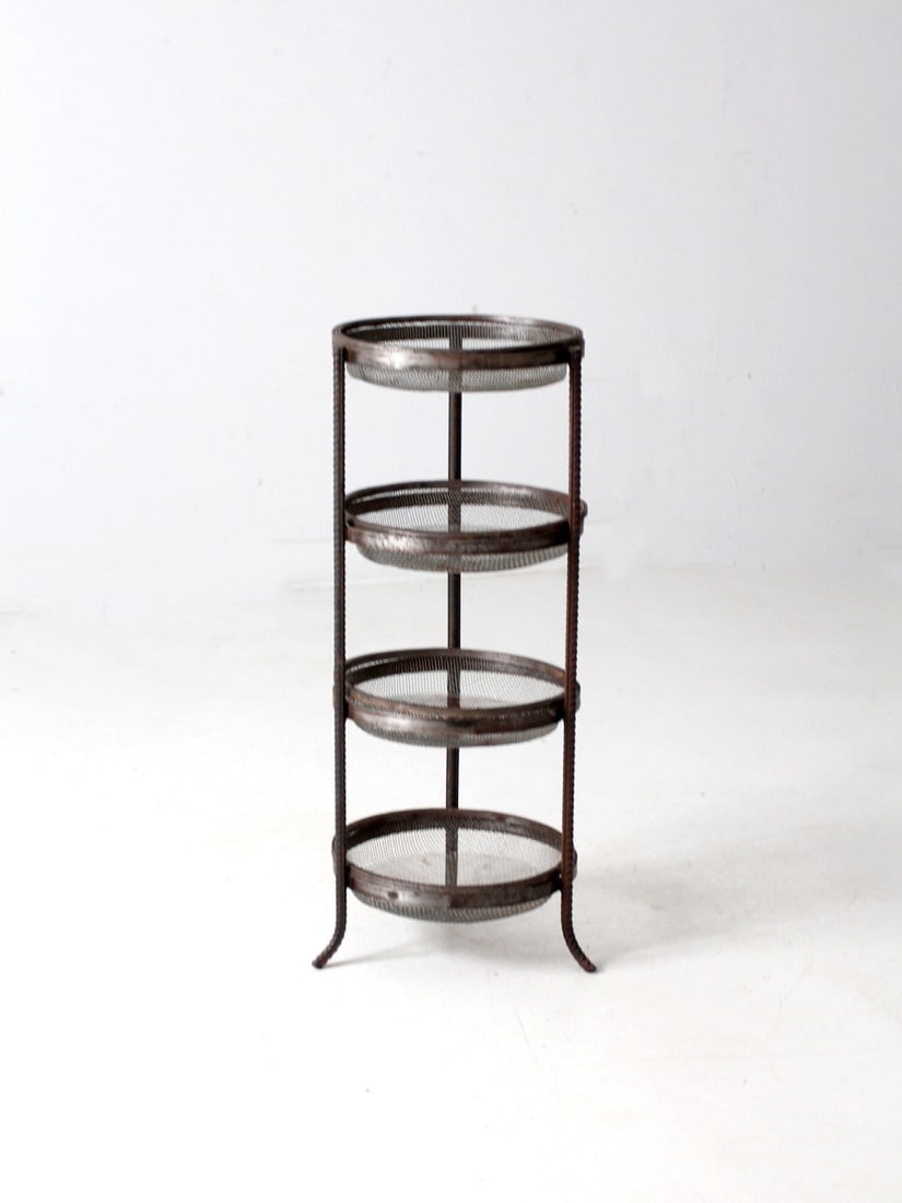 Industrial Vintage Metal Mesh 4-Tier Stand 31 Inch: Industrial Vintage Metal Mesh 4-Tier Stand 31 Inch This vintage metal mesh tiered stand boasts four round mesh tiers elegantly framed in industrial steel, supported by textured rod supports. Its open 