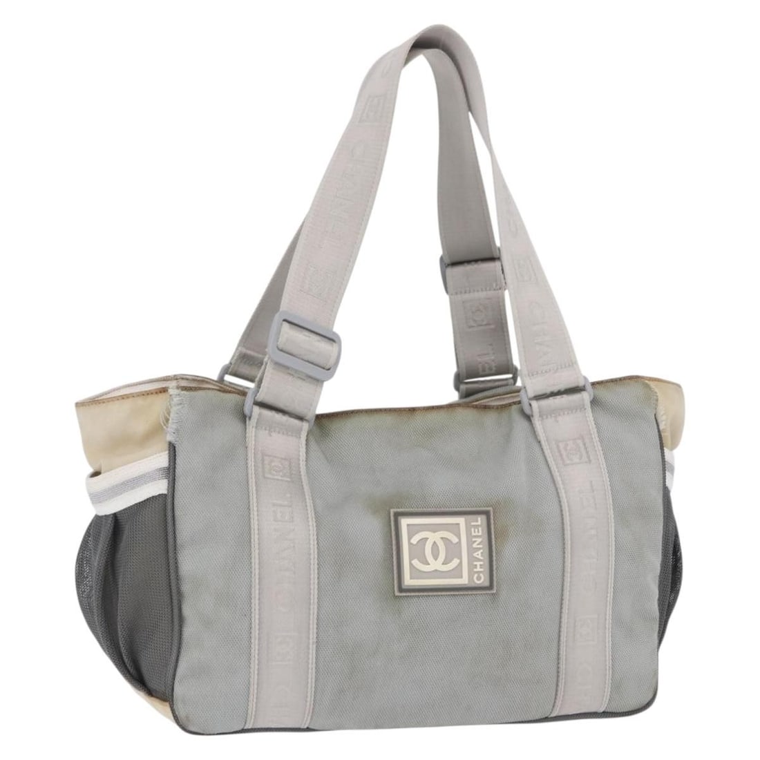 CHANEL Canvas Tote Bag Gray Silver CC Italy: CHANEL Canvas Tote Bag Gray Silver CC Italy Chanel Sports tote bag in gray and silver canvas, made in Italy. This women's tote has a heavily used condition with visible wear throughout, including an o