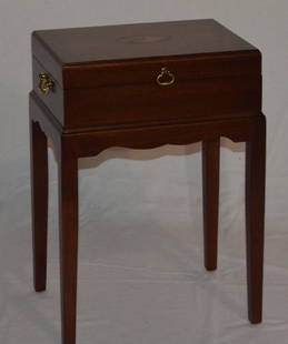 George III Style Mahogany Box on Stand: A George III style mahogany box on stand with nautilus inlay and brass handles. Property of Walter Wagner