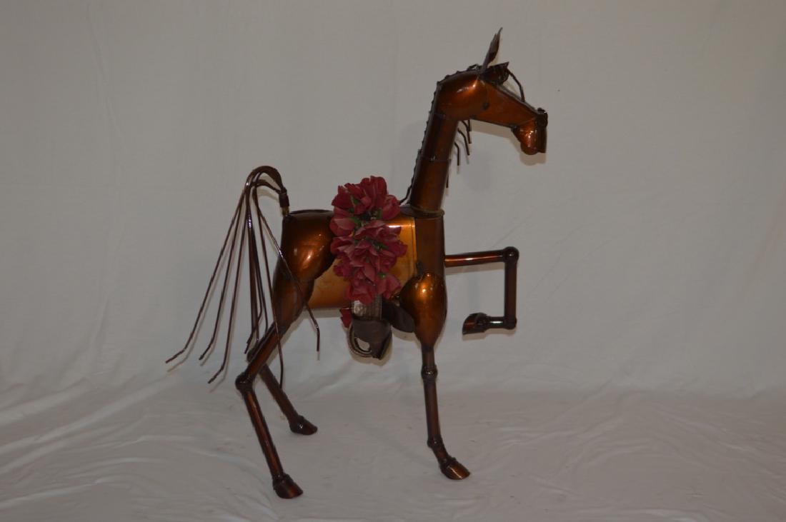 Folk Art Derby Winning Horse Sculpture: A folk art galloping horse, with a blanket of roses. Property of Walter Wagner