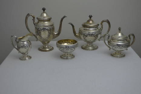 Towle Sterling Silver Five Piece Tea Set: Including: Chocolate Pot, Tea Pot, Creamer, Sugar and Waste Bowl, each marked on base. With foliate finial and arms, the body chased with scrolling acanthus. Property of Walter Wagner