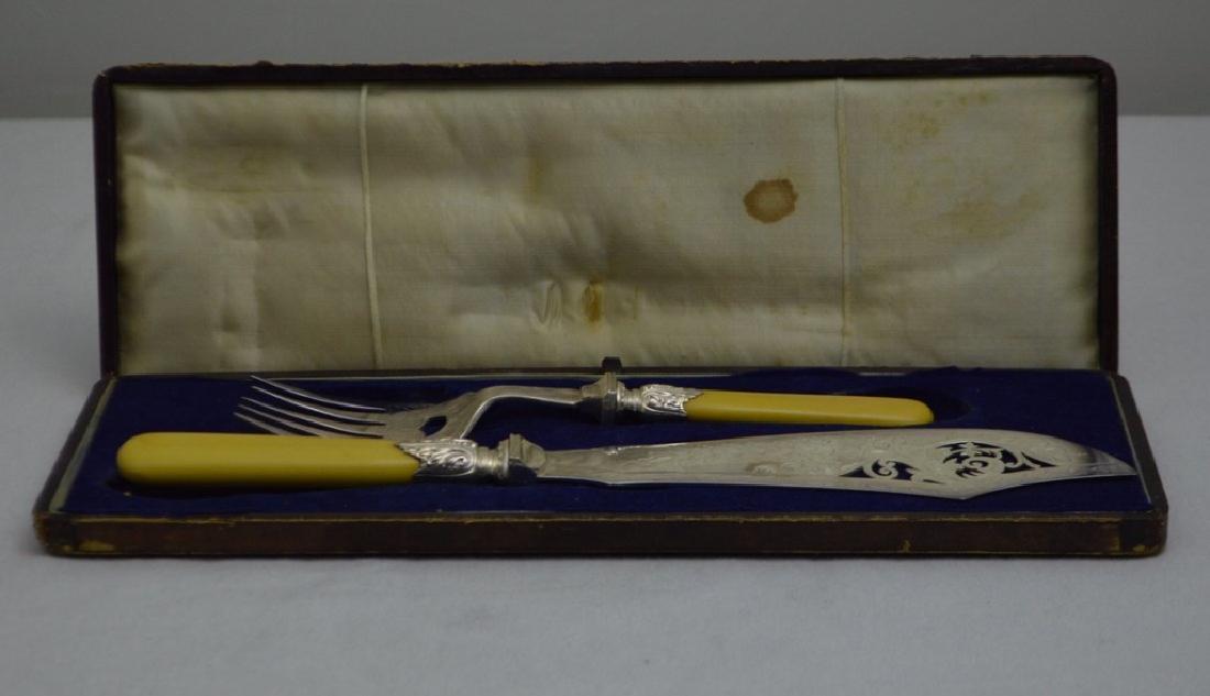 English Silver Plate Fish Cutlery Set: Both pieces marked indistinctly, with bone handles. Knife: 13 in. Fork: 9 in. Property of Walter Wagner