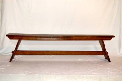 Antique American Oak Bench: An antique oak bench featuring flared supports and stretcher with mortise and tenon construction.