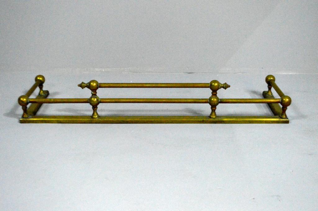 Regency Brass Fireplace Fender: Of open rectangular form, with circular bars joined with balls, the base of flat rectangular brass.
