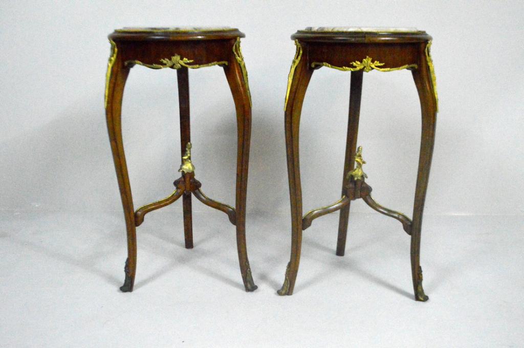 Pair of Louis XV Style Jardinieres: Each with round inset white marble top over a shaped and parcel-gilt mounted apron, the whole raised on three parcel-gilt mounted cabriole legs supported by a three-arm stretcher surmounted by a parce