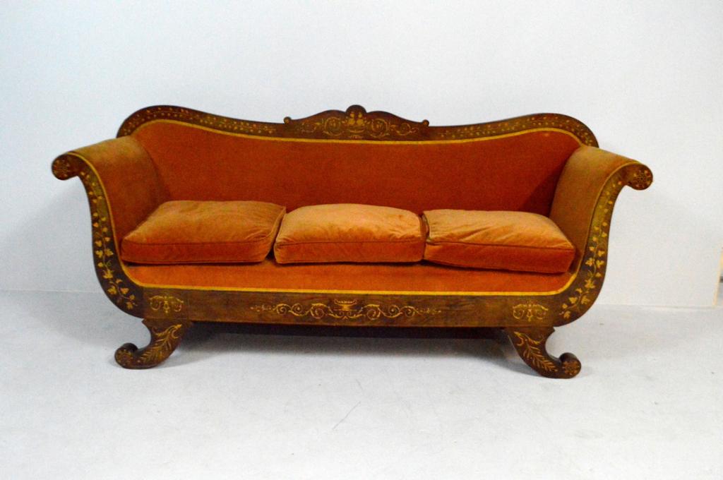 Dutch Neoclassical Revival Sofa: With an inlaid and shaped crestrail over an upholstered body and three cushions flanked by scrolling and inlaid legs and apron, the whole raised on four inlaid scroll legs.