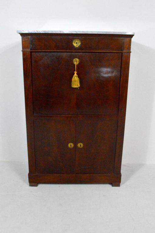 Late Regency Mahogany Secretary, Circa Mid-19th C.: With a marble top over a single drawer, over a drop down writing surface (opening to reveal...), over two doors that open to reveal a single shelf, raised on four carved rectangular legs.