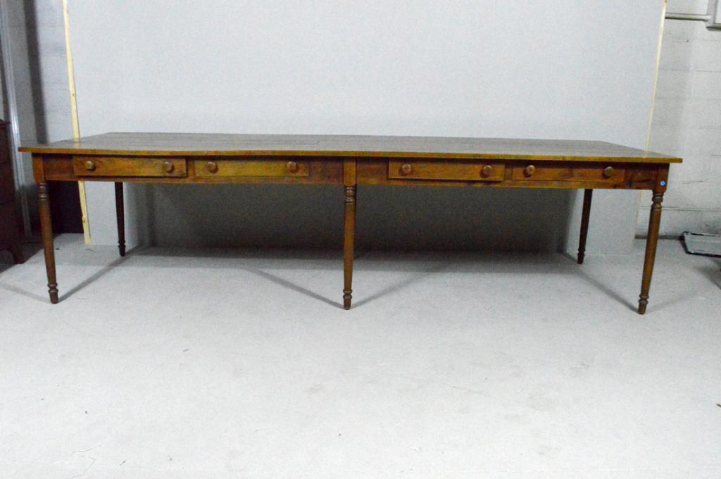 Large Antique Butternut Farm or Harvest Table: With a rectangular top over four drawers, the whole raised on six turned legs ending on peg feet. Of butternut with cedar secondary wood in drawers. Circa late 19th century. UPDATE: Listing updated fr