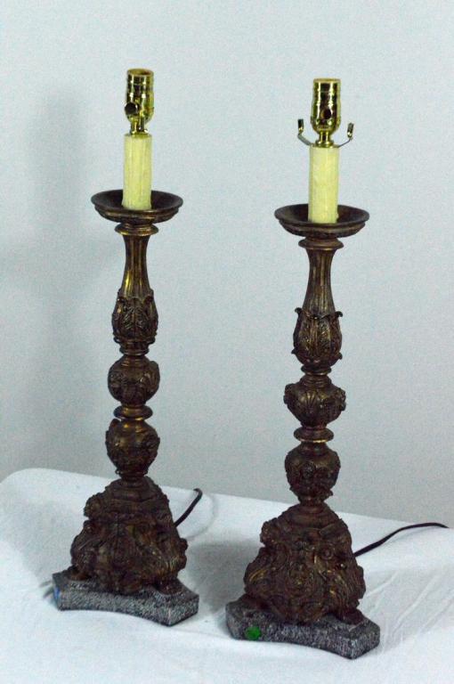 Pair of Renaissance Style Pricket Sticks as Lamps: Each with a wide capital and column of foliage worked on knops, the foliate triangular base raised on a black stone base.