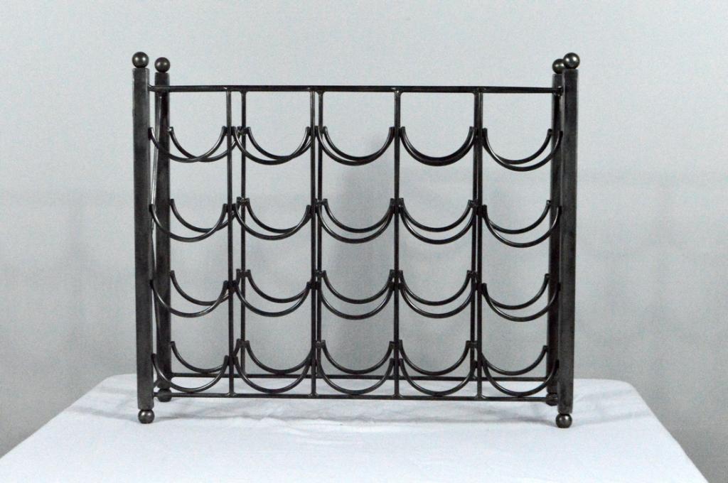 Metal Twenty Bottle Wine Rack: Of patinated brass with four tiers of five bottles, raised on four ball feet.