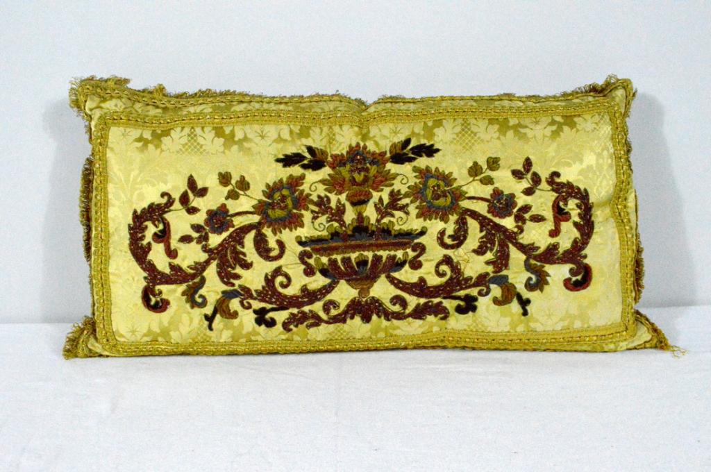 Rectangular Sofa Pillow: With stitched appliquÃ© floral urn design on front and brocade on rear Jerry Nichol, NY