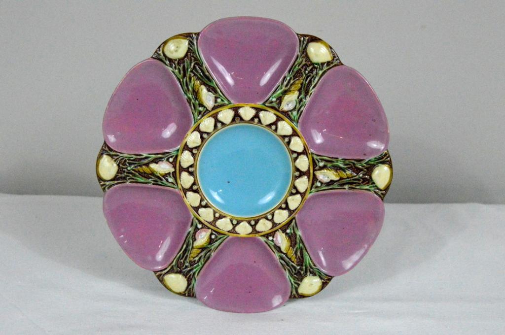 Minton Majolica Seaweed and Shell Oyster Plate: With purple oyster wells and a central blue well, with seaweed and shells