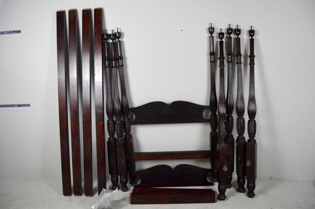 Matched Pair of Empire Style Acanthus Carved Beds: Each with four turned, carved and reeded posts with urn form finials, with shaped headboards and plain rails. Note: Antique beds might not adhere to standard mattress sizes.