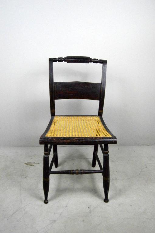 Antique American Sheraton Cane Seat Side Chair: With a turned back rail over a painted horizontal splat, over a caned seat, the whole raised on four turned legs supported by turned stretchers. 34 x 18 x 20 in.
