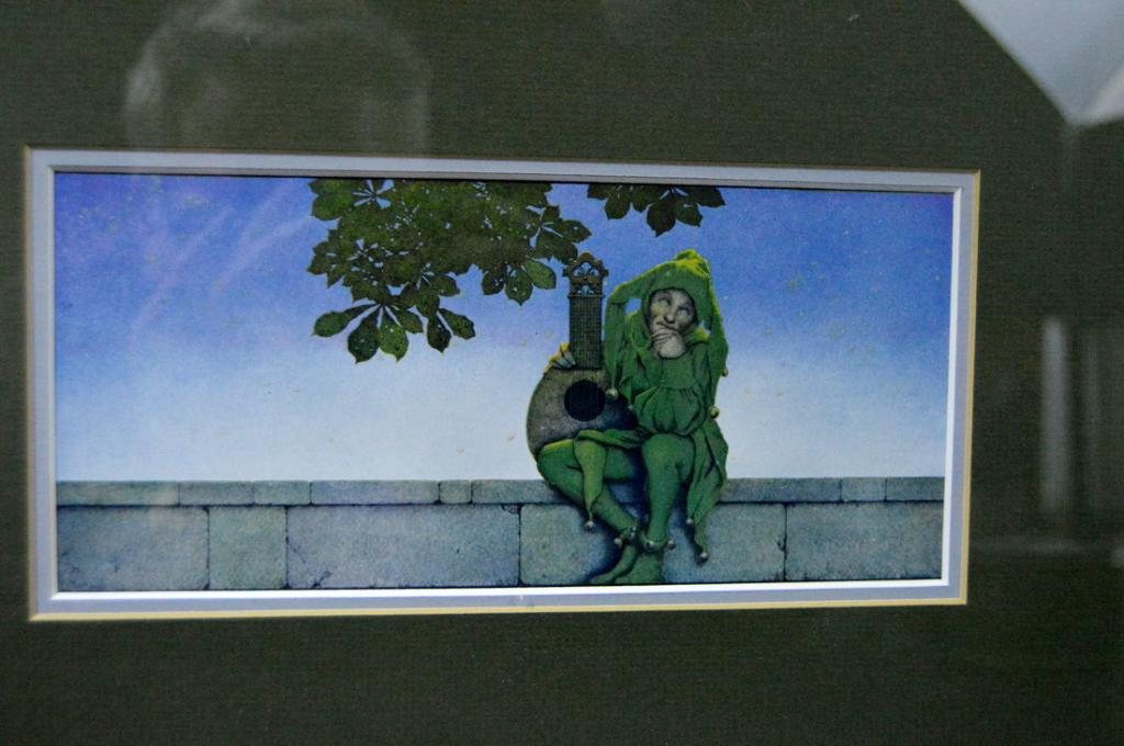 Maxfield Parrish (1870-1966), The Green Jester,: Circa 1920s, matted an glazed in a silvered wood frame. Frame: 10 x 15 in.