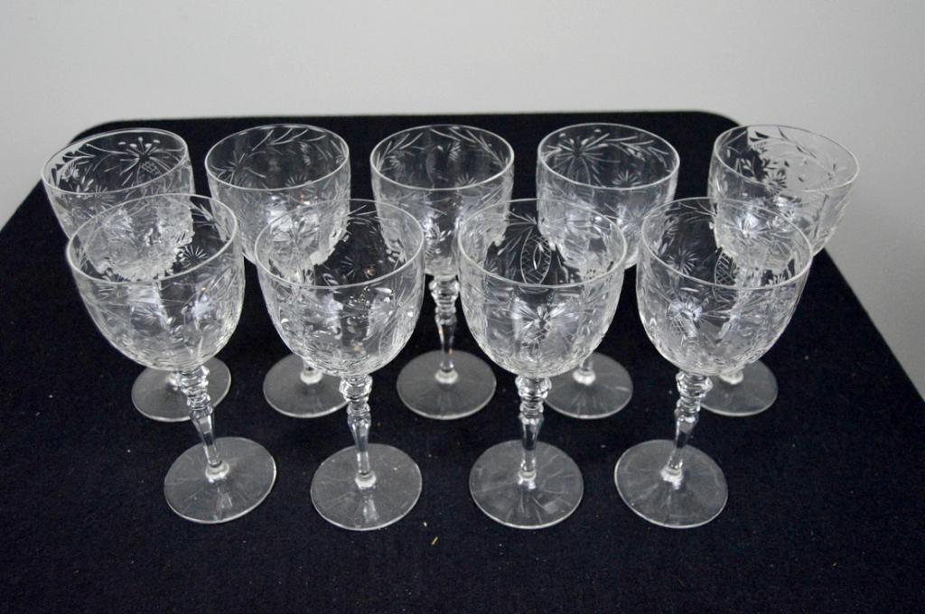Nine Cut Crystal Wine Glasses: Each with cut glass bowls over shaped stems and a plain foot 8.25 3.5