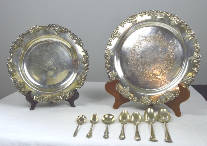 Collection of Silver Plate Items: Including: LBS Co. Charger, 14 in. diameter Charger, 12 in. diameter, CMC monogram Seven various spoons