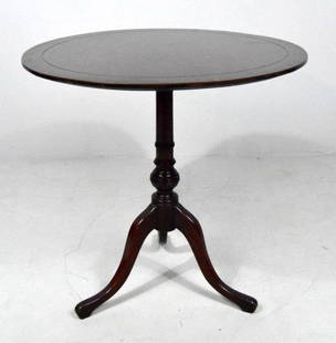 George III Mahogany Tilt-Top Tea Table: The circular top over a turned column the whole raised on three splayed legs. Label on bottom says "Terwilliger Book Table" 29 x 28 x 28 in.